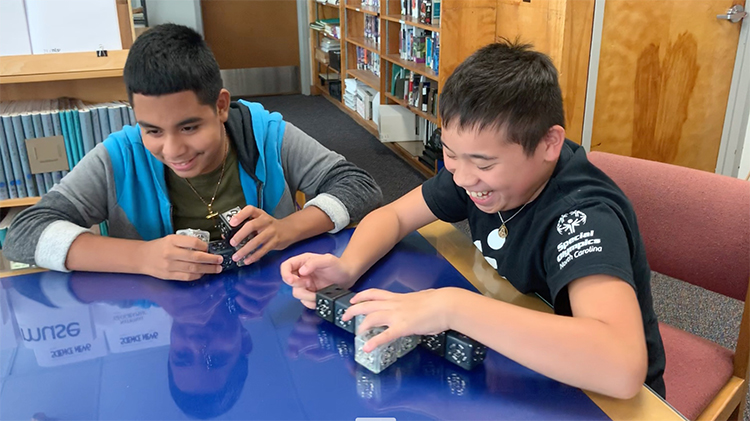 Two Governor Morehead School students investigate Cubelets as part of their makerspace time.